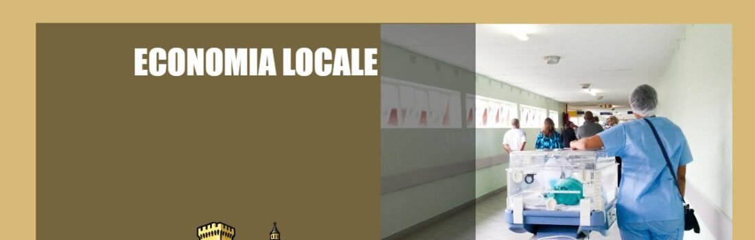 Operatore sanitario in corsia ospedaliera durante attività assistenziale